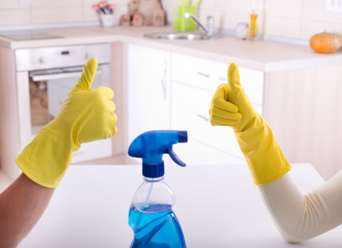 Technician applying safe cleaning practices to a carpeted floor