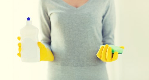 Local Airbnb cleaner preparing a Surrey rental property for new guests