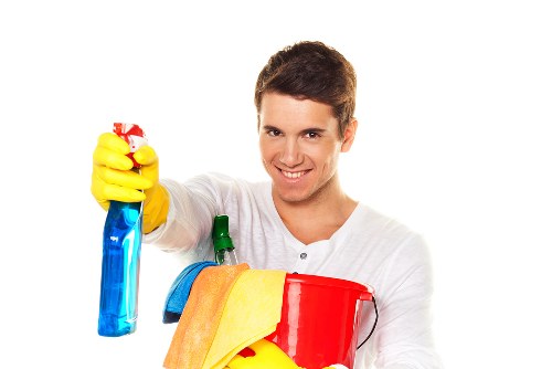 Cleaning windows, frames, and surfaces after building work in a Surrey property
